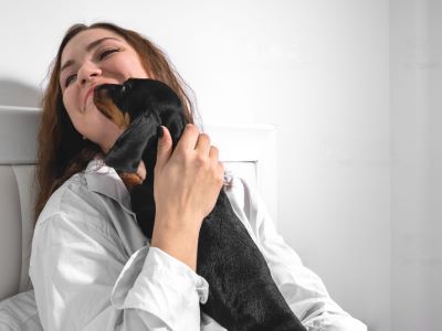 your dog bites your nose to play